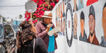 Pintan mural con rostros de personas desaparecidas
