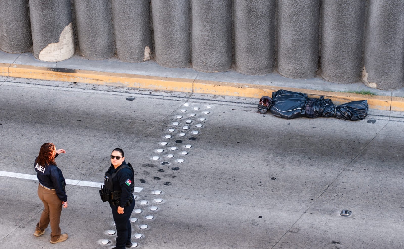 Hallan cuerpo embolsado en pleno puente de la Avenida Paseo de los Héroes